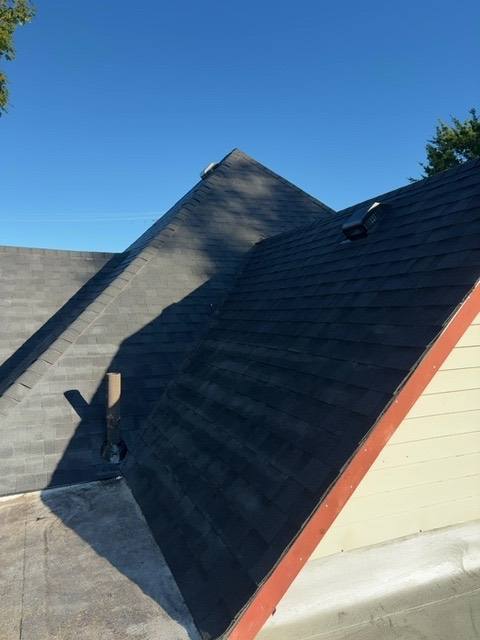 Pitched roof stripped to bare decking, showing gable detail in Piqua